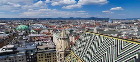 View across St. Stephen’s Cathedral’s patterned tiled roof and Vienna’s skyline