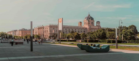 MuseumsQuartier forecourt with outdoor seating and the Kunsthistorisches Museum in the background