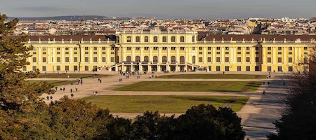 Schönbrunn Palace viewed from the gardens with Vienna’s skyline in the background