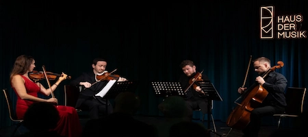 String quartet performing on stage at Haus der Musik in Vienna